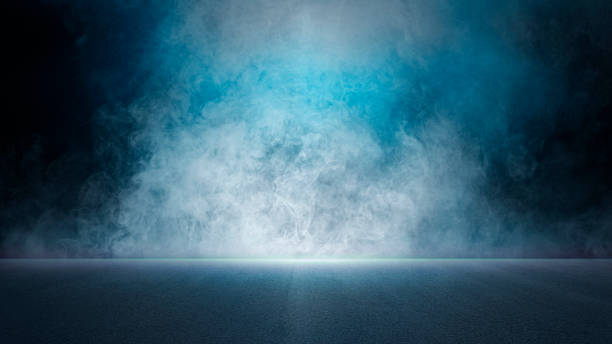 istock The dark stage shows, empty dark blue scene background, neon light, and spotlights The asphalt floor and studio room with smoke float up the interior texture for display products. 1403054445