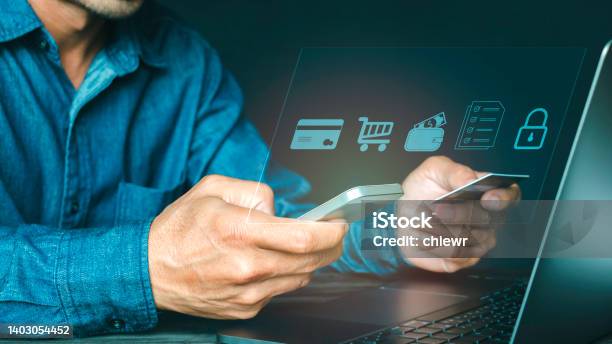 Man Using Mobile Phone And Credit Card Paying Via Mobile Banking App For Online Shopping With Technology Icon Digital Banking Stock Photo - Download Image Now