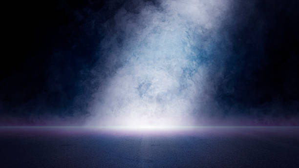 istock The dark stage shows, empty dark blue scene background, neon light and spotlights The asphalt floor and studio room with smoke float up 1403054488