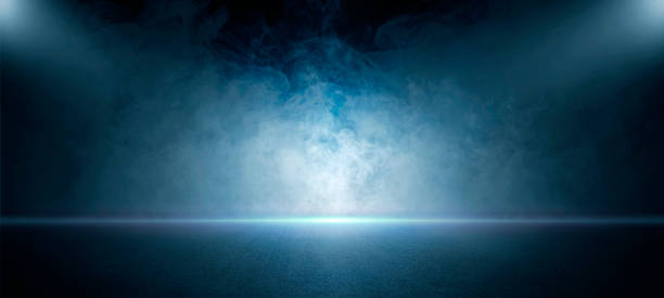 istock The dark stage shows, empty dark blue scene background, neon light, and spotlights The asphalt floor and studio room with smoke float up the interior texture for display products. 1403054507
