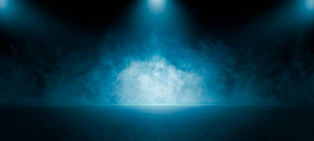 istock The dark stage shows, empty dark blue scene background, neon light, and spotlights The asphalt floor and studio room with smoke float up the interior texture for display products. 1403054549