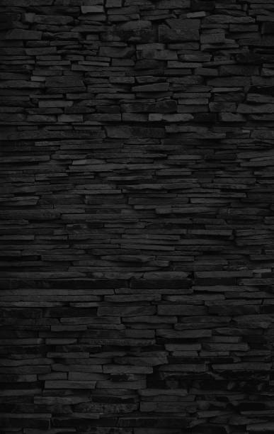 sfondo nero di granito della lastra, parete di pietra di ardesia - retro revival pattern masonry old foto e immagini stock