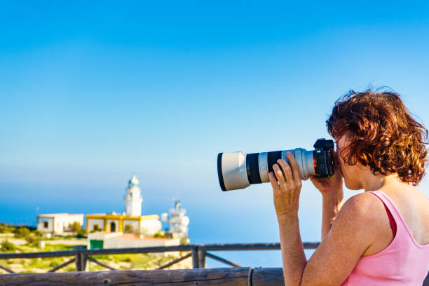 istock Tourist take photo at lighthouse, Cabo de Gata, Spain 1403059465