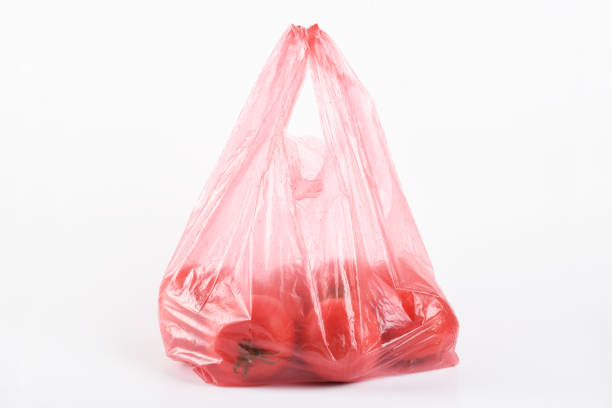 istock Tomatoes in the plastic bag isolated on the white background 1403060246
