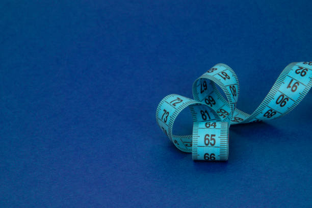 istock Colorful tape measure spiral with copyspace background 1403060681