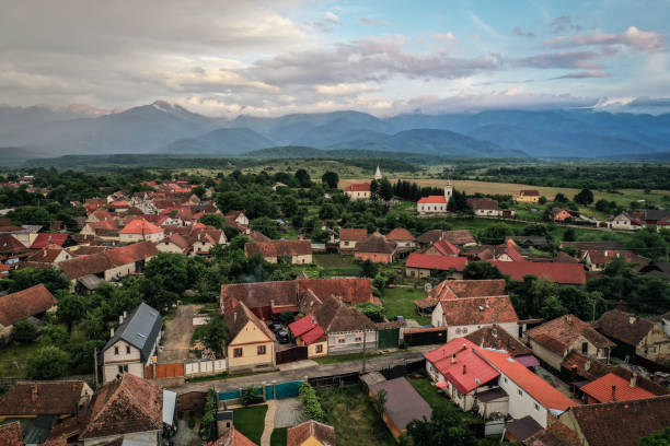 Transylvanian old village of Porumbacu photographed from drone with Fagaras mountains in the background stock photo