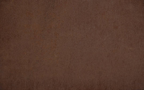 istock Metal corroded texture, selective focus. Dark worn rusty metal textured background. Vintage effect. Rusty iron surface background with scratches and cracks. 1403061071