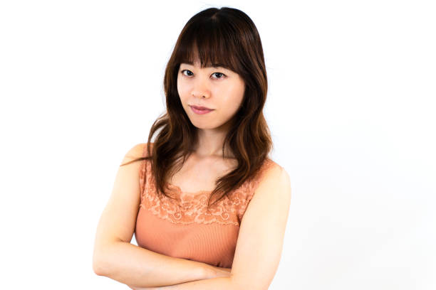istock Young woman with arms folded 1403062116