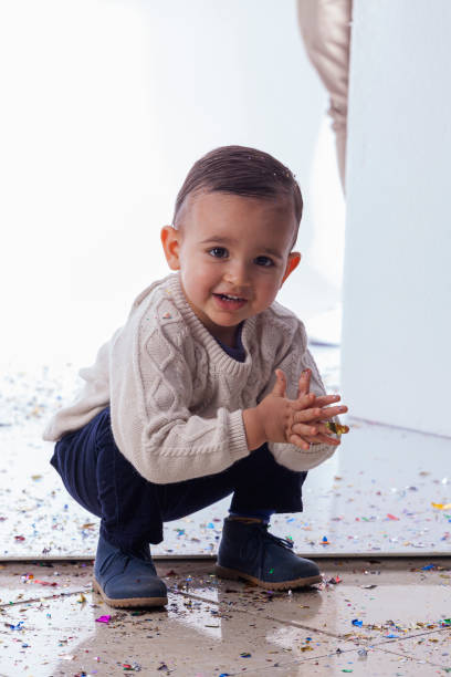 istock Latin boy looks at the camera that portrays him in a photo studio 1403062182