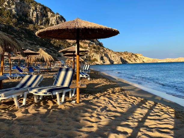 istock Umbrellas and lounges on the Tsambika beach 1403064982