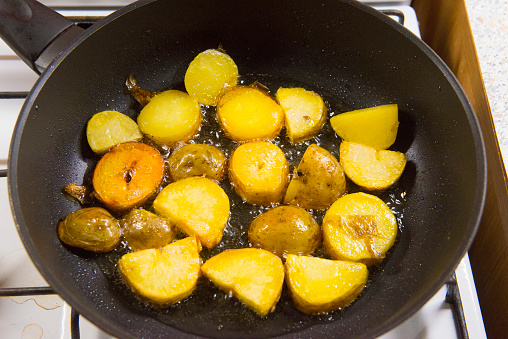 Boiled potatoes fried in vegetable oil
