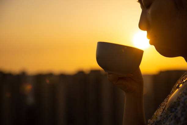 istock Close-up women drinking coffee with sunlight in the morning 1403069609