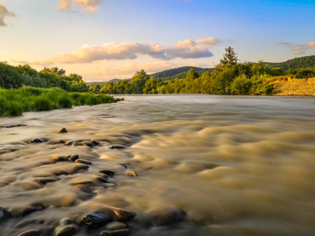 Landscape of a mountain river at sunset stock photo