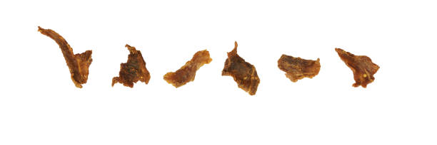 istock pork jerky on white background. dried meat 1403071511