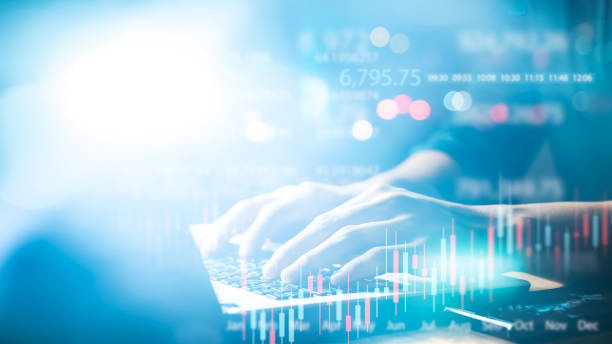 istock Businessman working in modern office, technical price chart and red and green candlestick chart indicator. 1403072880