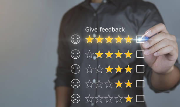 istock Customer review good rating concept hand pressing five star on visual screen and positive customer feedback testimonial. 1403077569
