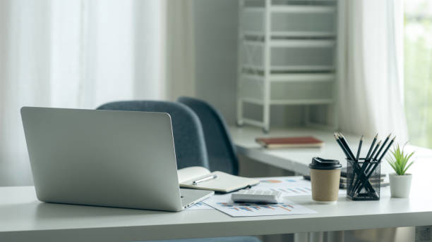 istock Laptop blank screen on wood table with business office background, mockup, template for your text 1403077772