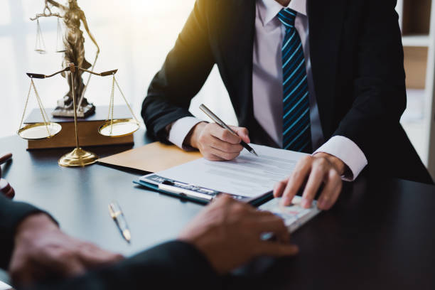 istock lawyer taking dollar bribe from the female client for falsifying documents, businessman taking bribes corruption illegal fraud bribery concept. 1403078601