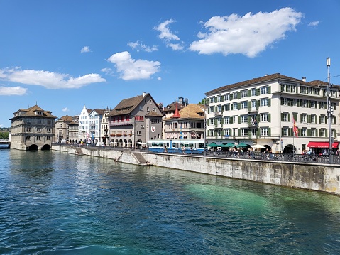Canton Zurich, Switzerland - 4 JUNE 2022 : Cityscape on River Limmat shore in Zurich city.