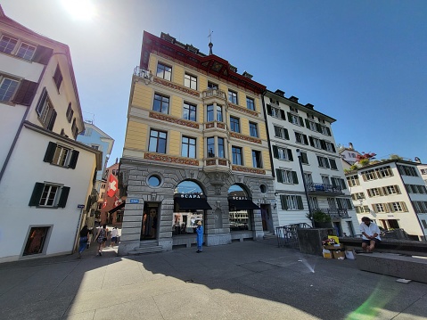 Canton Zurich, Switzerland - 4 JUNE 2022 : Exterior of building near Rathausbrucke on River Limmat shore in Zurich city.