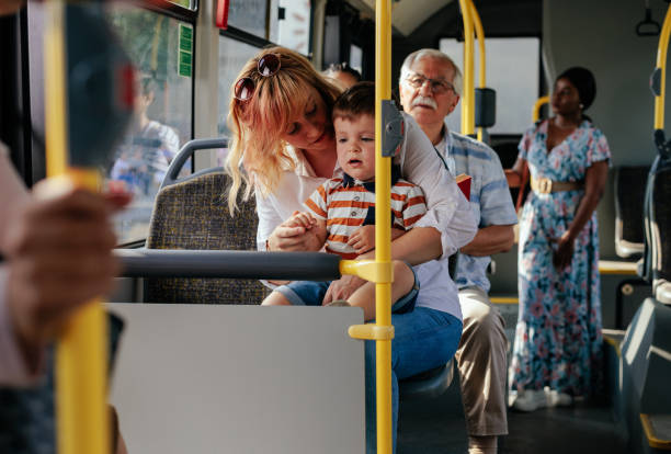 istock Mom and son in city bus 1403080392