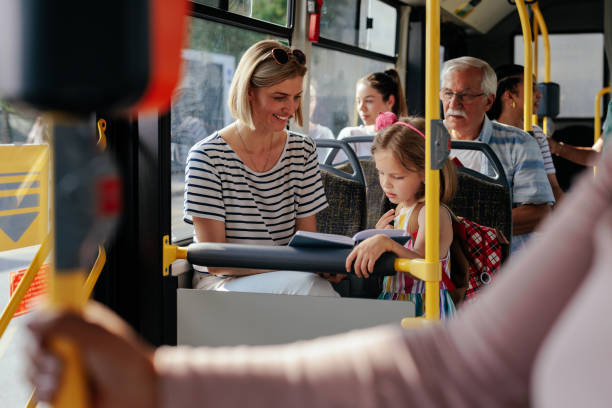 istock Mom and daughter riding bus 1403080443