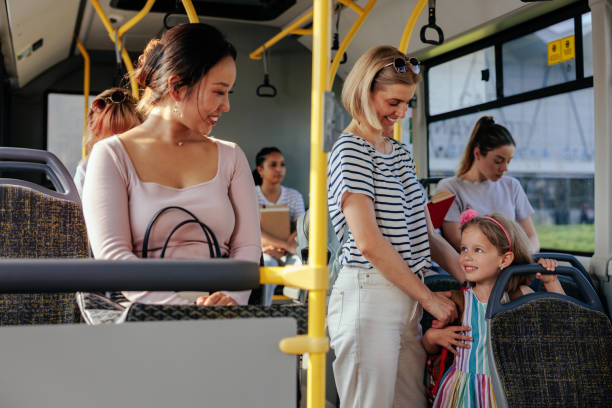 istock Child with mom talk to passenger on bus 1403080445