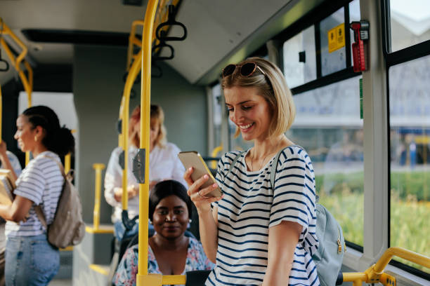 istock Young caucasian woman texting on city bus 1403080471