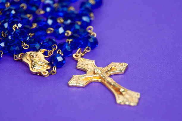 istock Holy Rosary on purple background. Religious concept. 1403080605