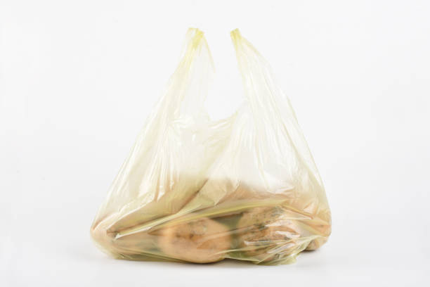 istock Potatoes in the plastic bag isolated on the white background 1403080770