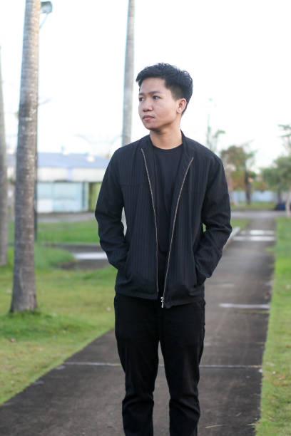 istock young man relaxing at city park 1403080836
