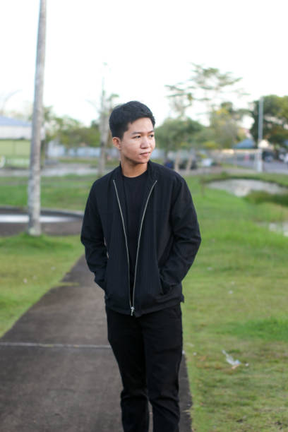 istock young man relaxing at city park 1403080838