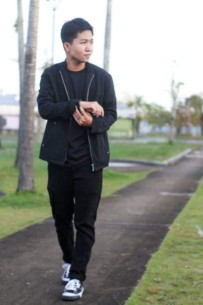 istock young man relaxing at city park 1403080844