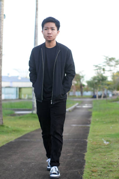 istock young man relaxing at city park 1403080847