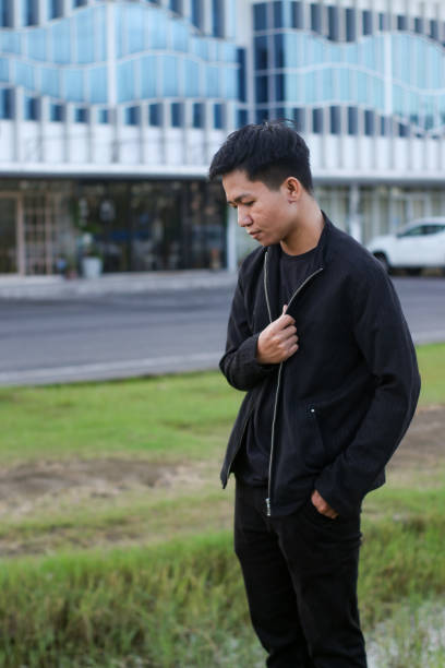 istock young man relaxing at city park 1403080896
