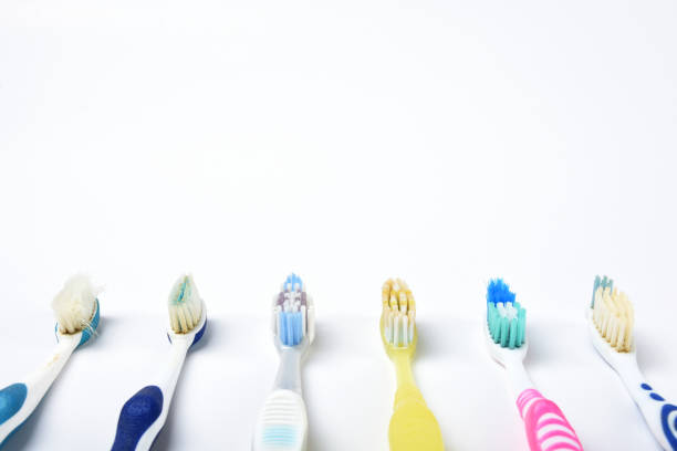 istock Old toothbrushes isolated on the white background 1403085550