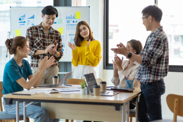 istock Young businessman team meeting clapping motivating colleagues. 1403085571