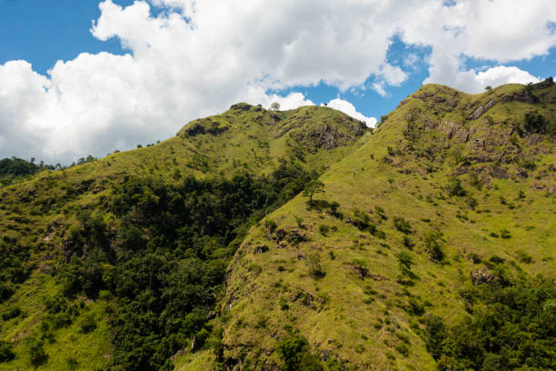 istock Mountain peaks and blue sky with clouds. 1403087067