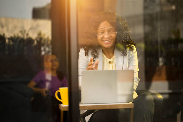 istock Businesswoman using laptop at cafe 1403087195