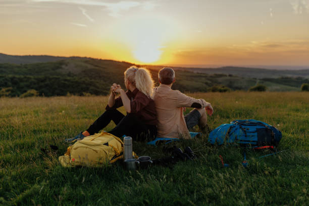 istock Couple of hikers resting on mountain 1403087612