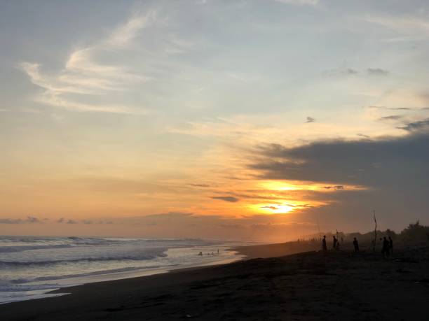 istock sunset on the beach with black sand 1403087790