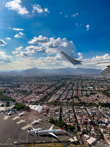 Airplane flying over Mexico City after taking off