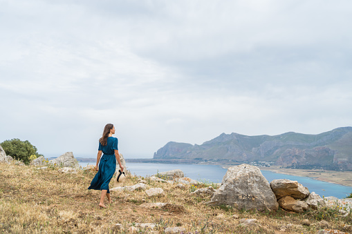 She looks off towards Mediterranean Sea in the distance