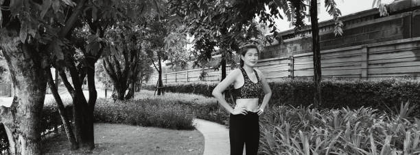 istock Woman running in the public park. 1403094212