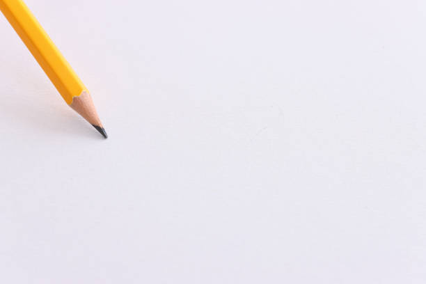 istock Top view image of pencil over white textured paper 1403094731