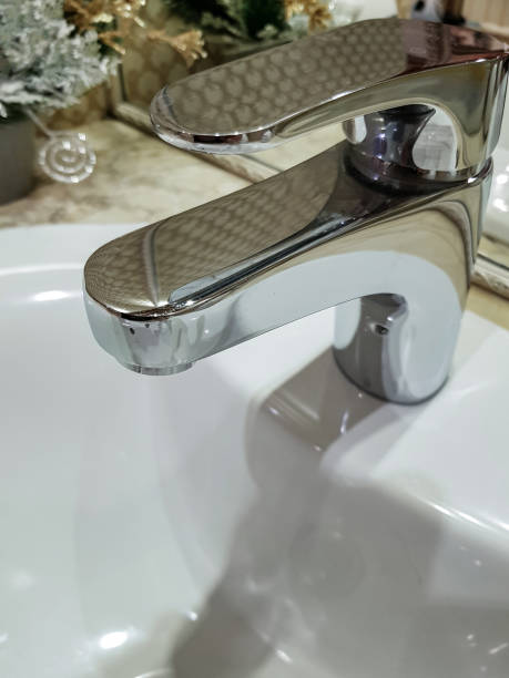istock Bathroom interior with luxury chrome sink faucet. Modern design 1403094848