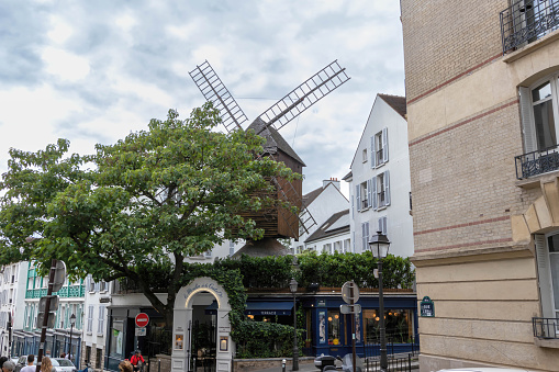 Paris, France - July 11, 2018: Housed in an old mill, this restaurant serves French classics in a cozy dining room or a terrace.