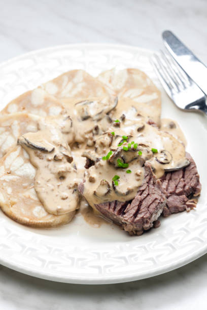 istock beef meat with mushroom sauce and dumplings 1403096144