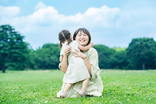 istock mother and her daughter hugging in the park 1403096170
