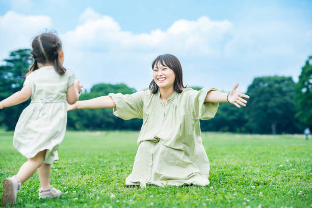 istock mother and her daughter hugging in the park 1403096264
